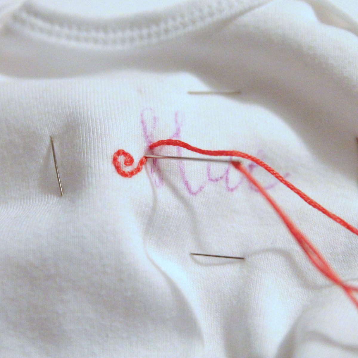 how to hand embroider a onesie