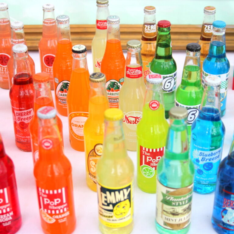 a rainbow of soda bottles