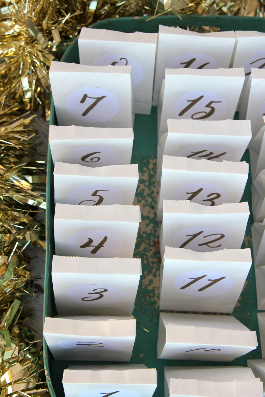 super simple advent calendar (make this with just small paper bags, these free printable labels, a tray and some treats)