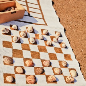Use a table runner to make an outdoor game mat