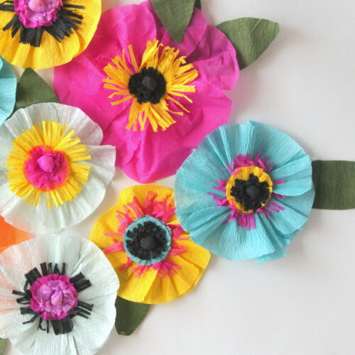 Easiest ever crepe paper flowers - each one takes about ten minutes (or, if you make an assembly line, you can make whole pile in an hour!). Party decor (or even room decor!) perfection.