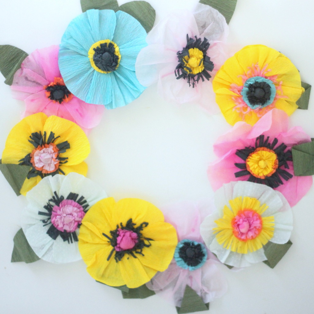 Easiest ever crepe paper flowers - each one takes about ten minutes (or, if you make an assembly line, you can make whole pile in an hour!). Party decor (or even room decor!) perfection.