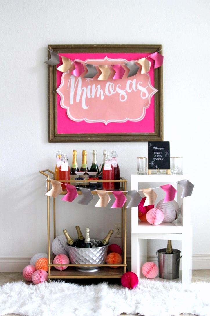 Perfect for baby showers, bridal showers (or even a Valentine's Day bash!)- this pink Mimosa Bar is so fun and SO easy to put together!
