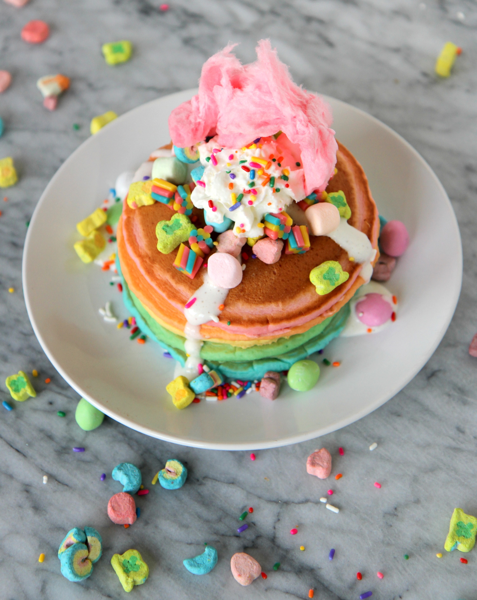 The perfect pancakes for a big (dessert) celebration (aka "crazy cakes")... a stack of rainbow pancakes with a pile of wild toppings!