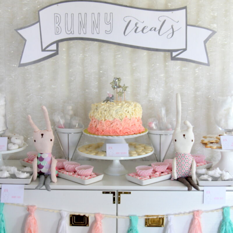 snow bunny themed first birthday party decor